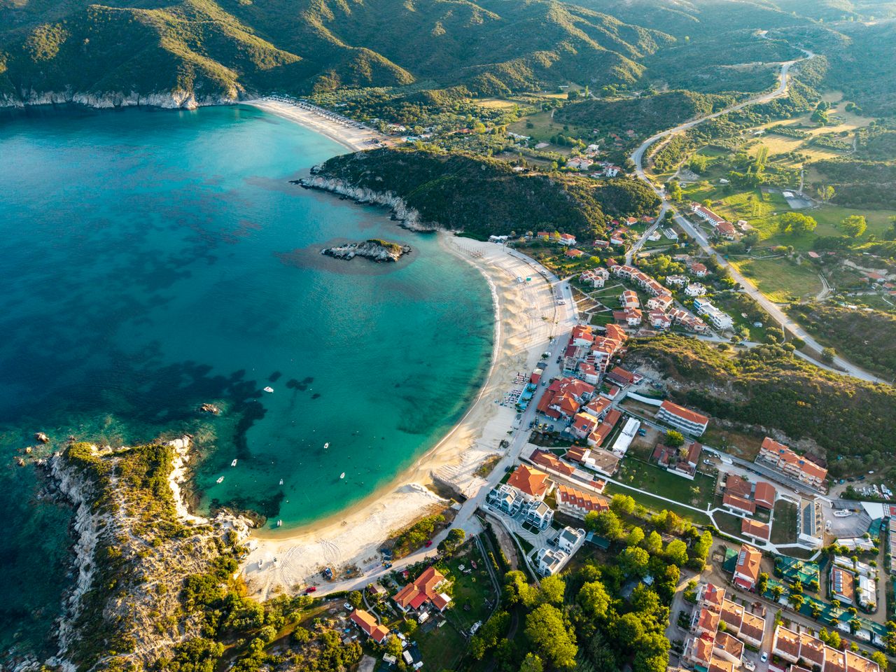 The Art of Drawing Readers In: Your attractive post title goes here Explore the scenic beauty of Kalamitsi Beach, a stunning coastal paradise in Sithonia, Greece.